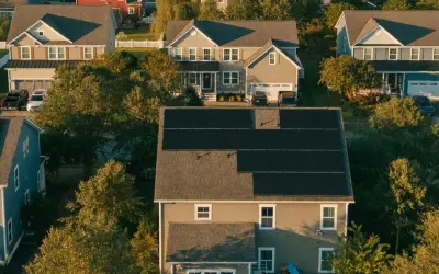Aerial view of homes with solar installed on their roofs