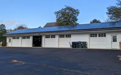 Rooftop solar panels being cleaned to remove dirt and debris