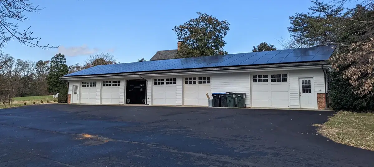 Rooftop solar panels being cleaned to remove dirt and debris