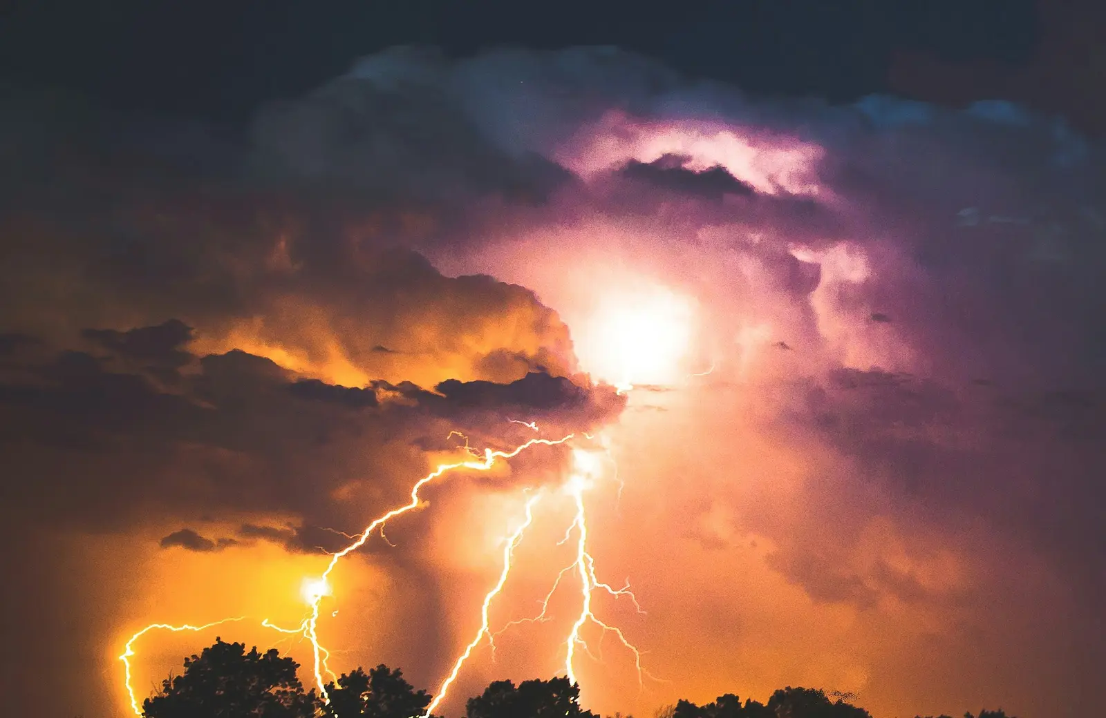 Lightning storm over homes in Virginia at night