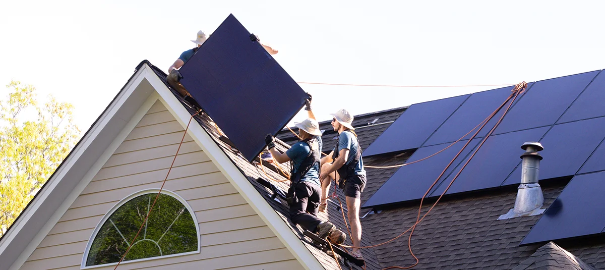 Virtue Solar crew installing REC solar panels on a roof in Virginia