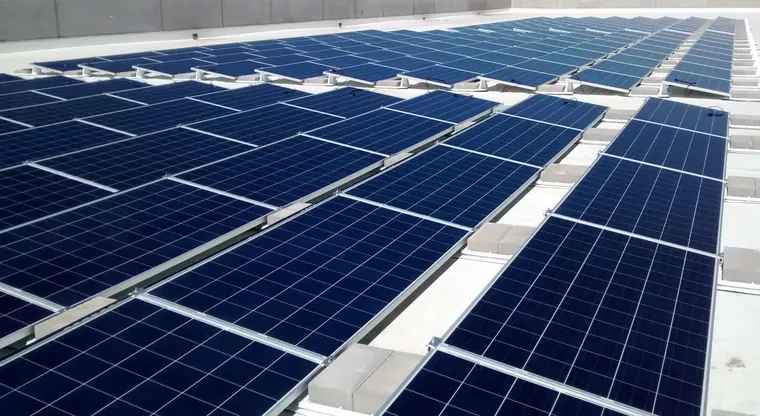 Ballasted commercial solar array on a flat TPO roof in Virginia