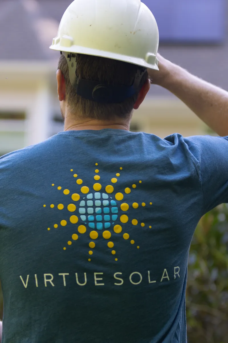 Virtue Solar install crew member on a commercial job site