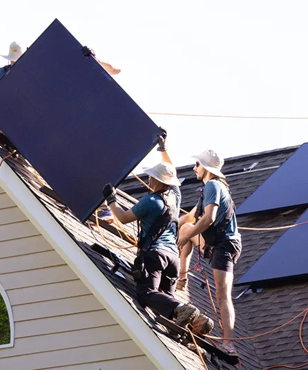 Installing REC solar panels on roof in Virginia