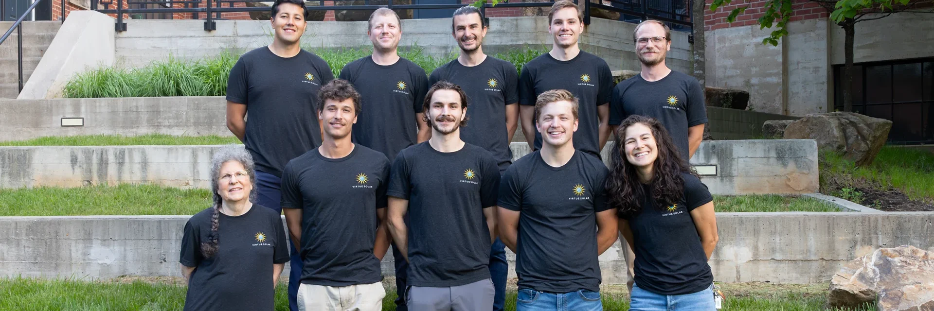 Virtue Solar Company staff photo in front of building in Charlottesville, VA.
