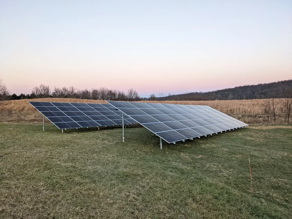 This ground-mounted solar array has inverters mounted in the shade.