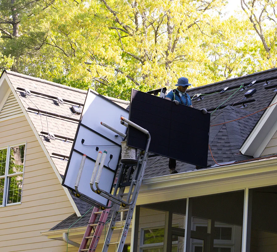 Local solar company installing solar panels on a roof