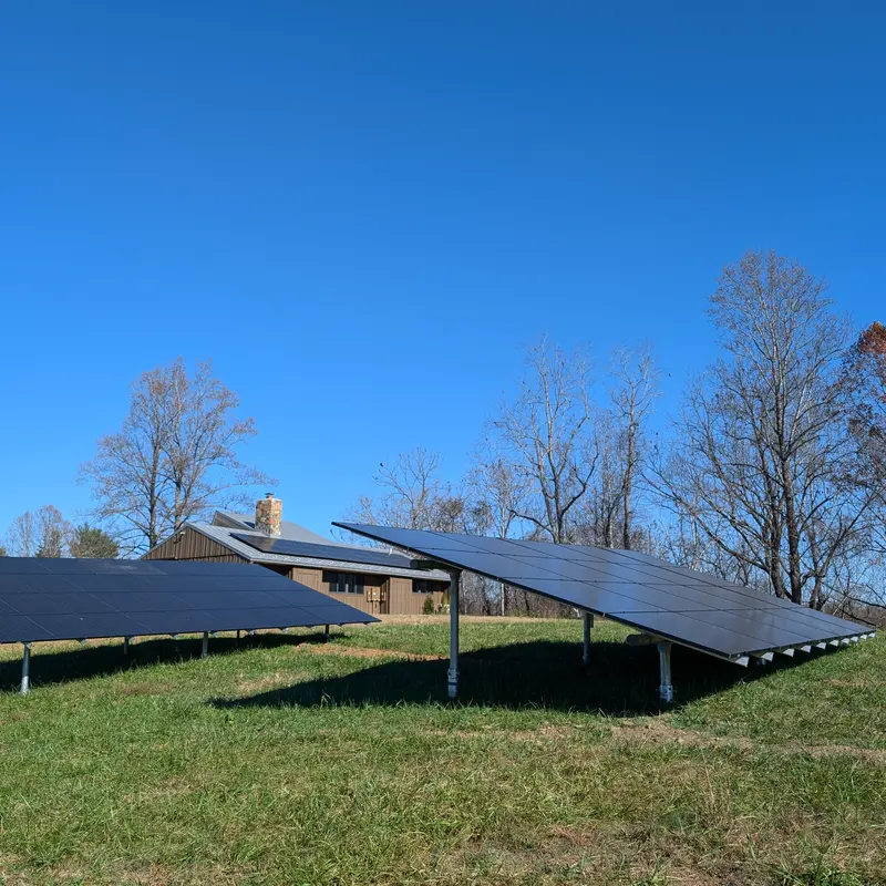 A solar home in Virginia, with roof-mounted panels, and an array in the yard.