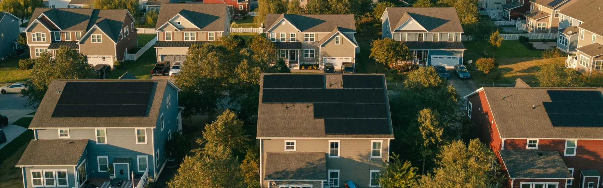 Aerial view of homes with solar installed on their roofs