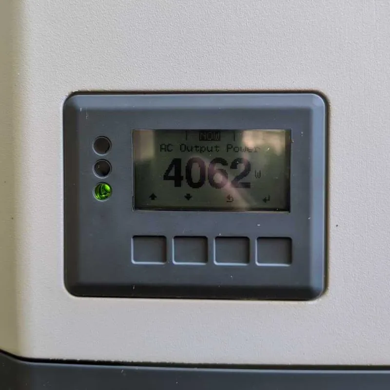 Fronius inverter display reading 4062 watts AC output power with a green status light