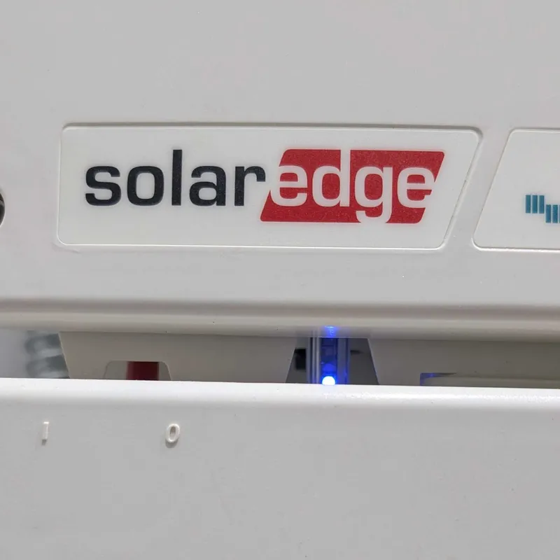 SolarEdge inverter showing only the blue communication light and no green production light during the day