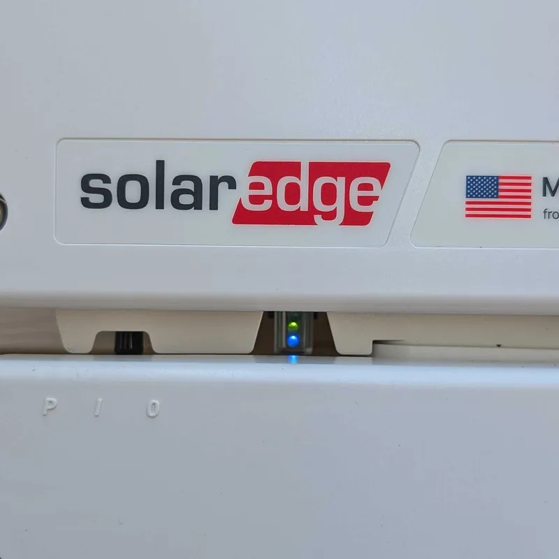 SolarEdge inverter showing both the green production light and blue communication light