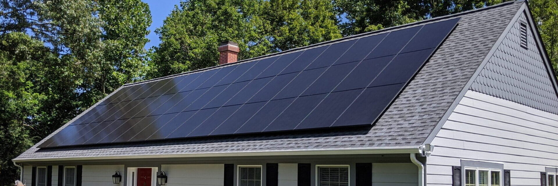 rooftop solar panels professionally installed on white house in Virginia